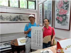 叶天来与丁自强老师在纪念孔子诞辰2566周年书画展上